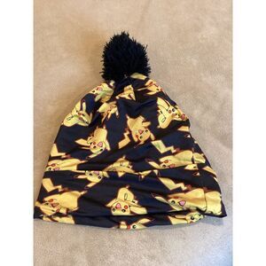 Black with Yellow and red Pokemon print beanie hat with Pom Pom‎ on top